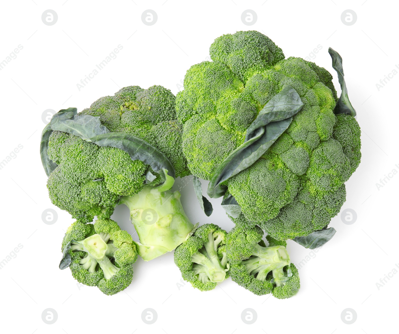 Photo of Pile of fresh raw green broccoli isolated on white, top view