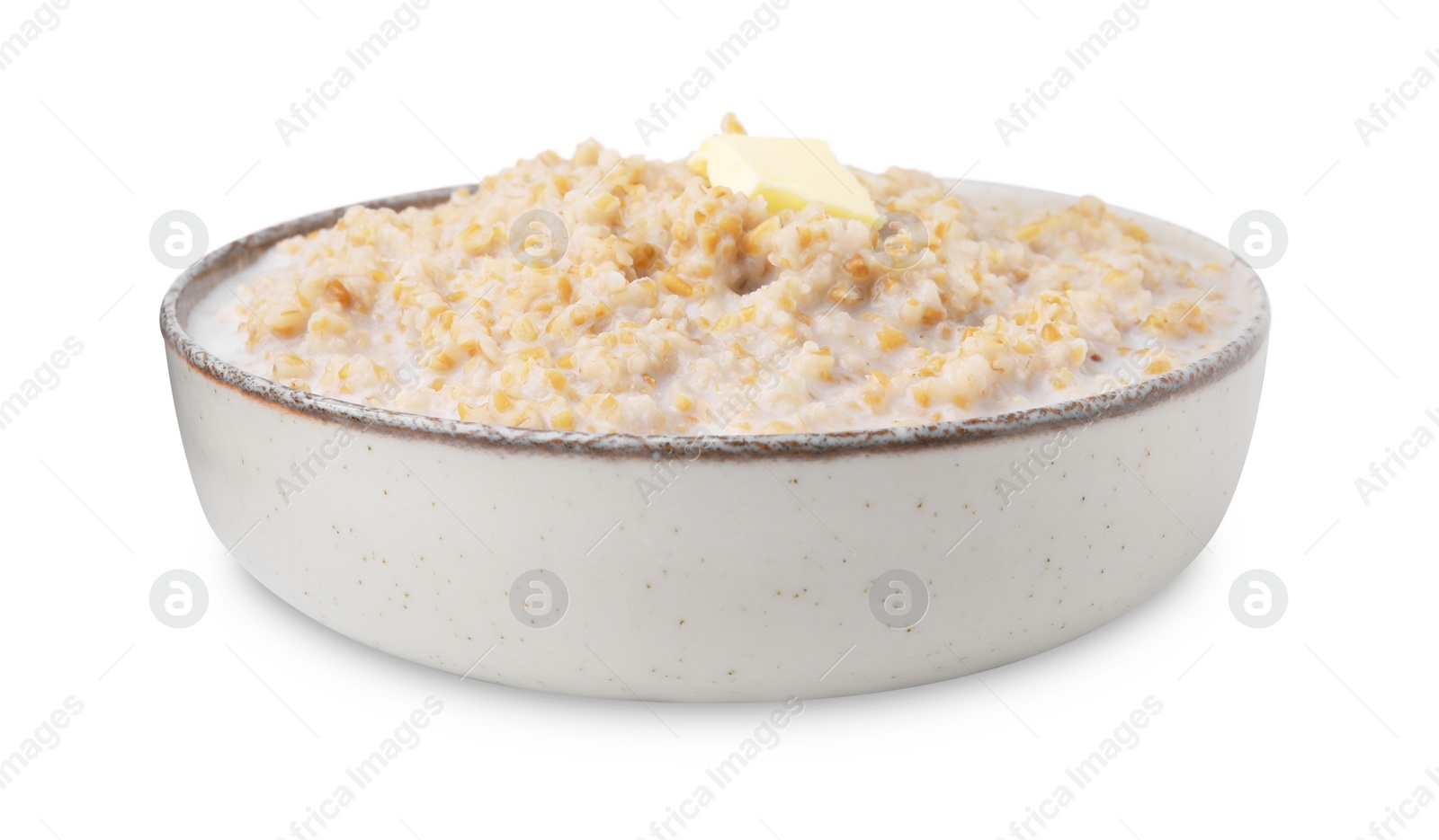 Photo of Tasty wheat porridge with milk and butter in bowl isolated on white