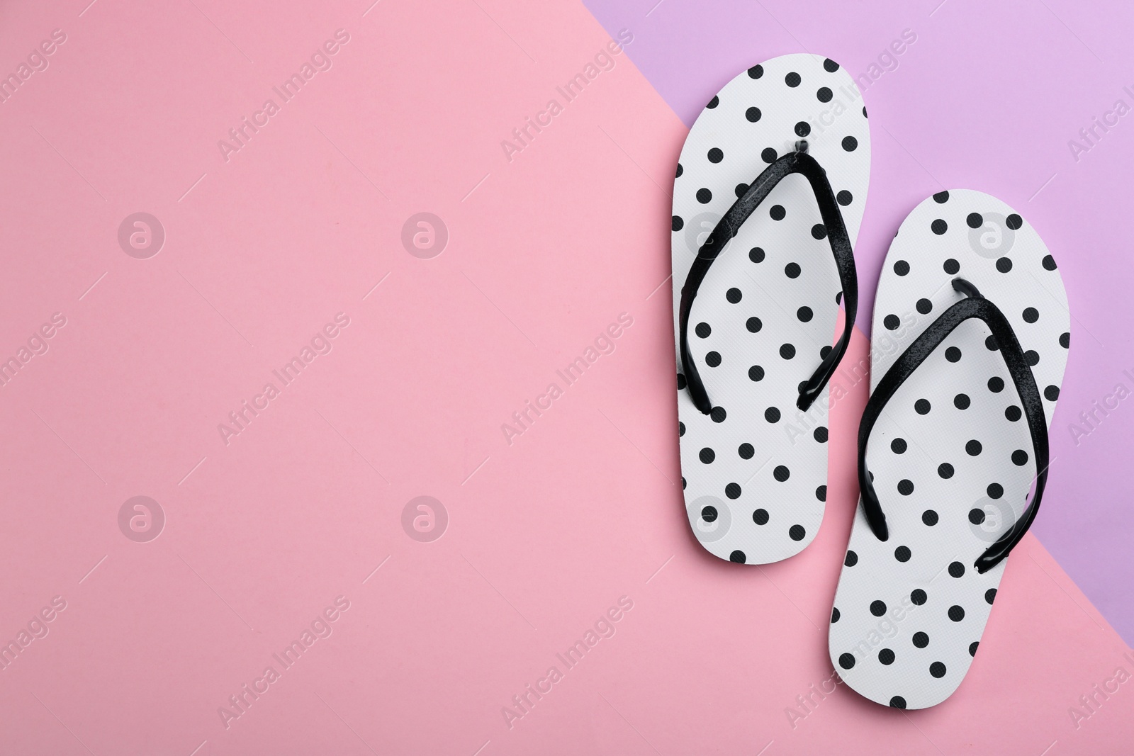 Photo of Stylish flip flops on color background, flat lay. Space for text