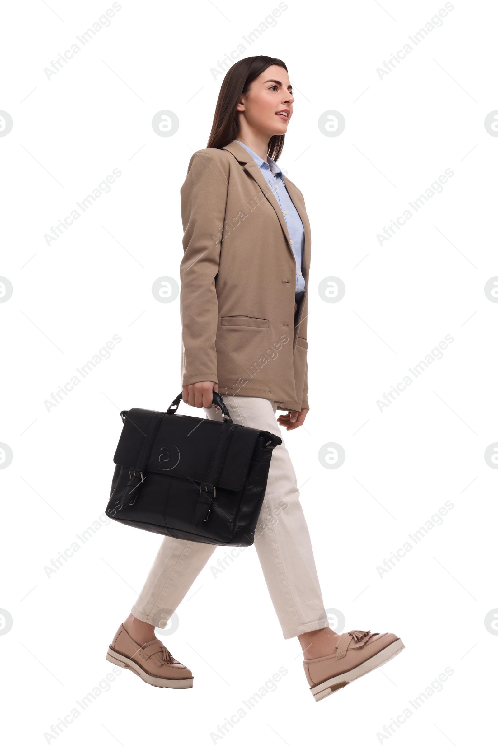 Photo of Beautiful businesswoman with briefcase walking on white background