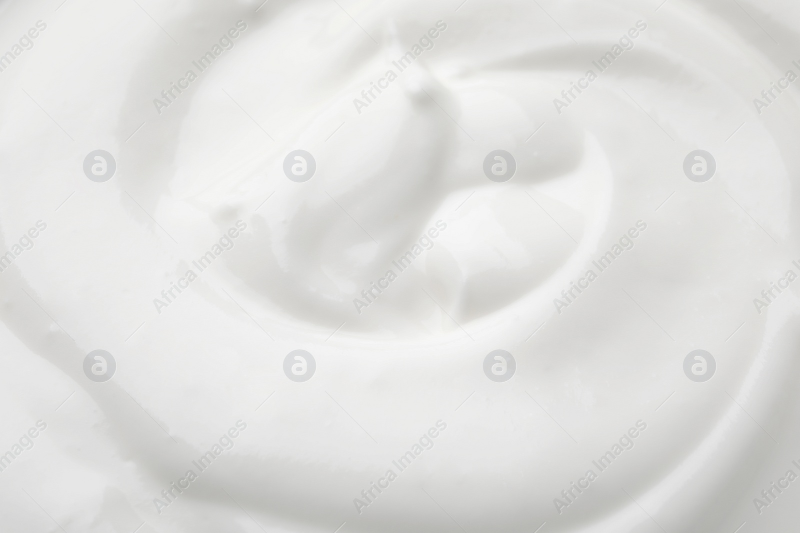 Photo of Delicious creamy yogurt as background, closeup view