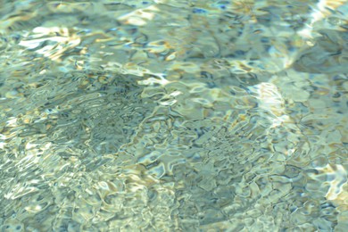 Rippled water in swimming pool as background