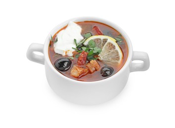 Photo of Meat solyanka soup with sausages, olives and vegetables in bowl isolated on white