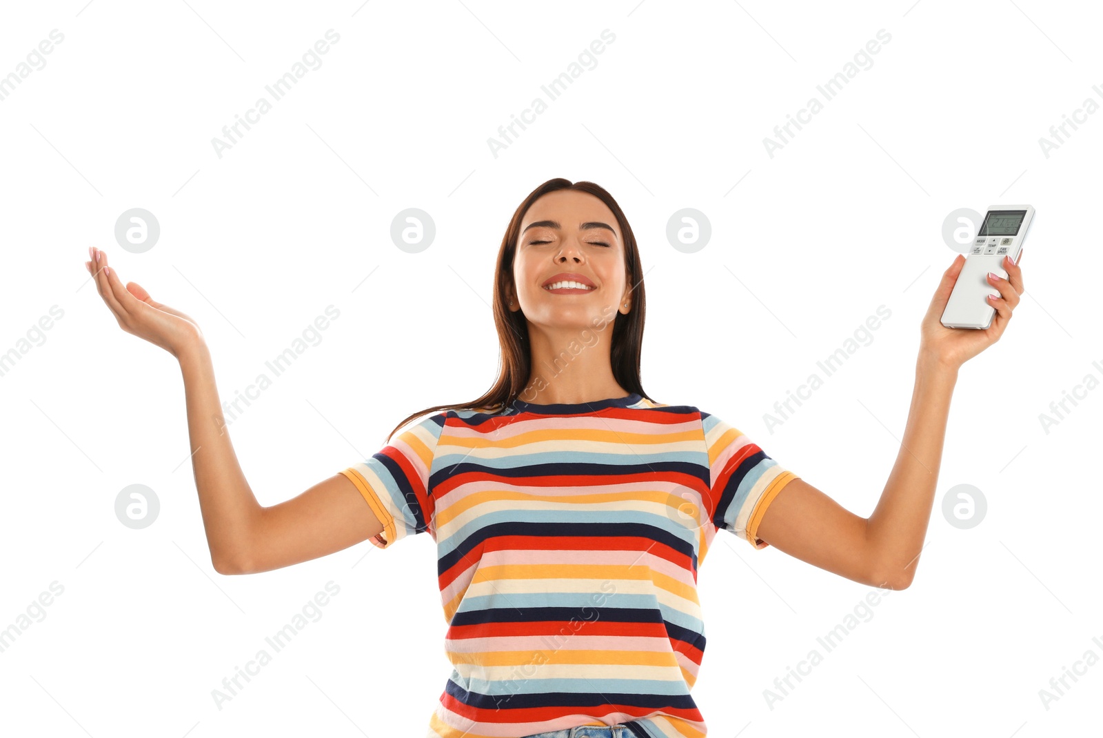 Photo of Young woman with air conditioner remote on white background