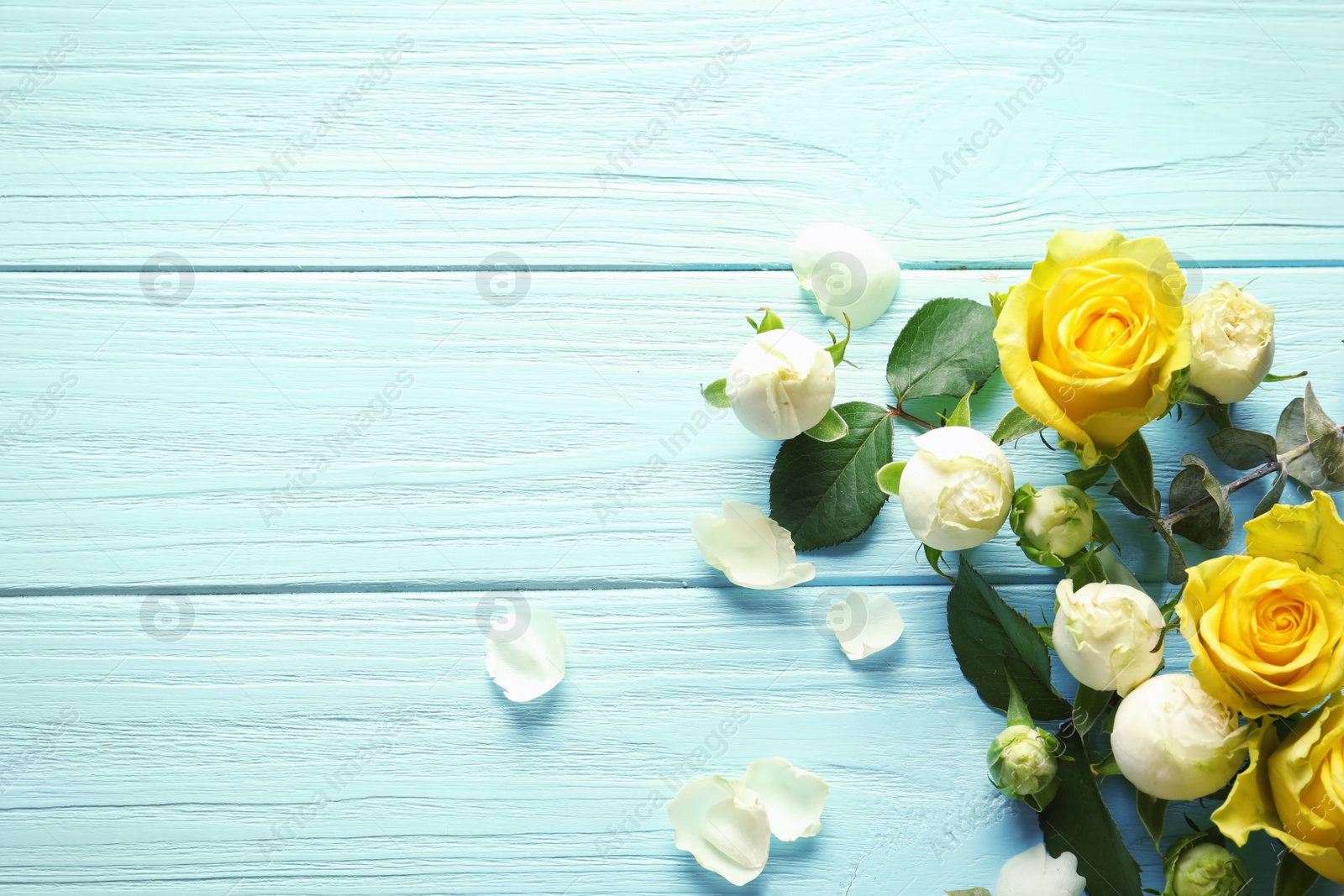 Photo of Flat lay composition with beautiful blooming flowers on wooden background