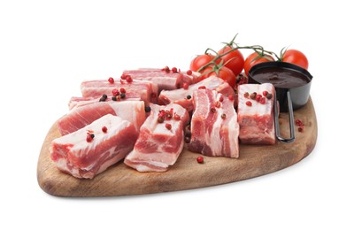 Cut raw pork ribs with peppercorns, tomatoes and sauce isolated on white