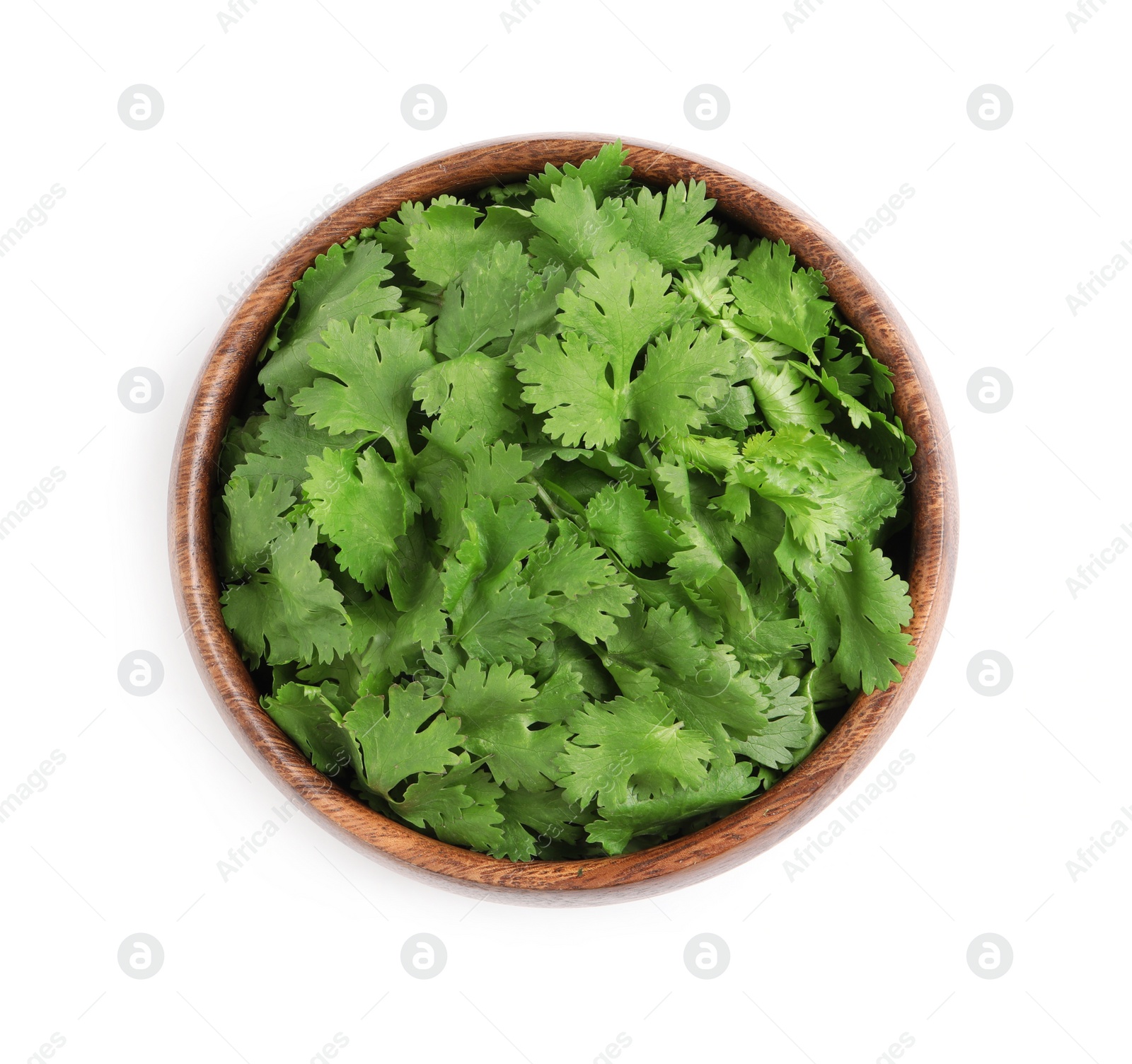 Photo of Bowl with fresh green coriander leaves isolated on white, top view