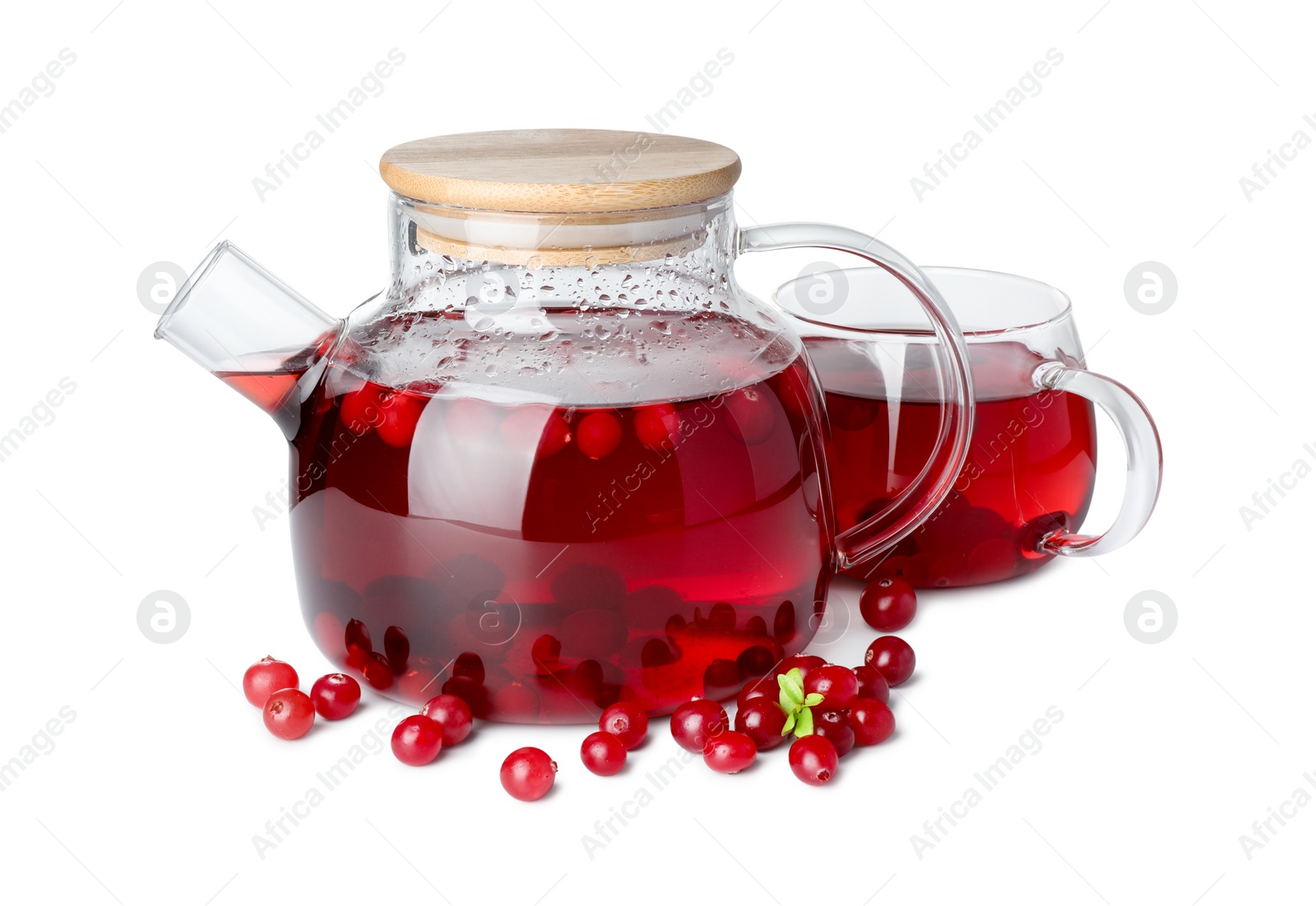 Photo of Tasty hot cranberry tea with fresh berries isolated on white