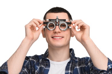 Photo of Vision testing. Young man with trial frame on white background