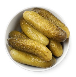 Photo of Tasty pickled cucumbers in bowl isolated on white, top view