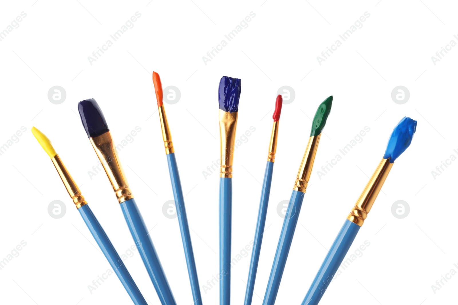 Photo of Different brushes with paints on white background