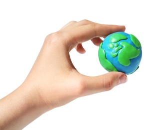 Woman holding plasticine model of planet Earth on white background, closeup