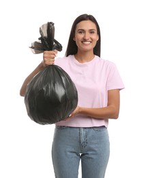 Photo of Woman holding full garbage bag on white background