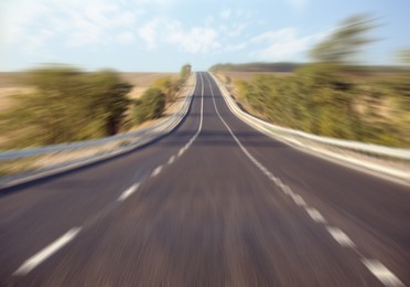 Image of Asphalt country road without transport, motion blur effect