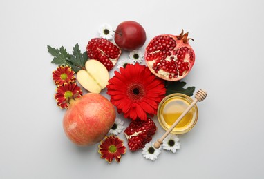 Photo of Flat lay composition with Rosh Hashanah holiday attributes on white background