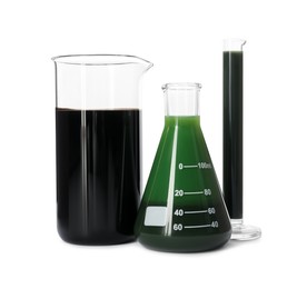 Photo of Beaker, test tube and flask with different types of oil isolated on white