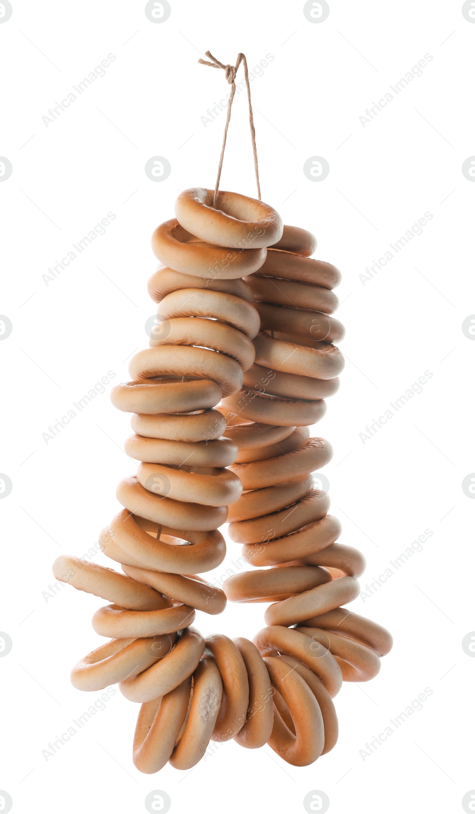 Photo of Bunch of delicious ring shaped Sushki (dry bagels) on white background