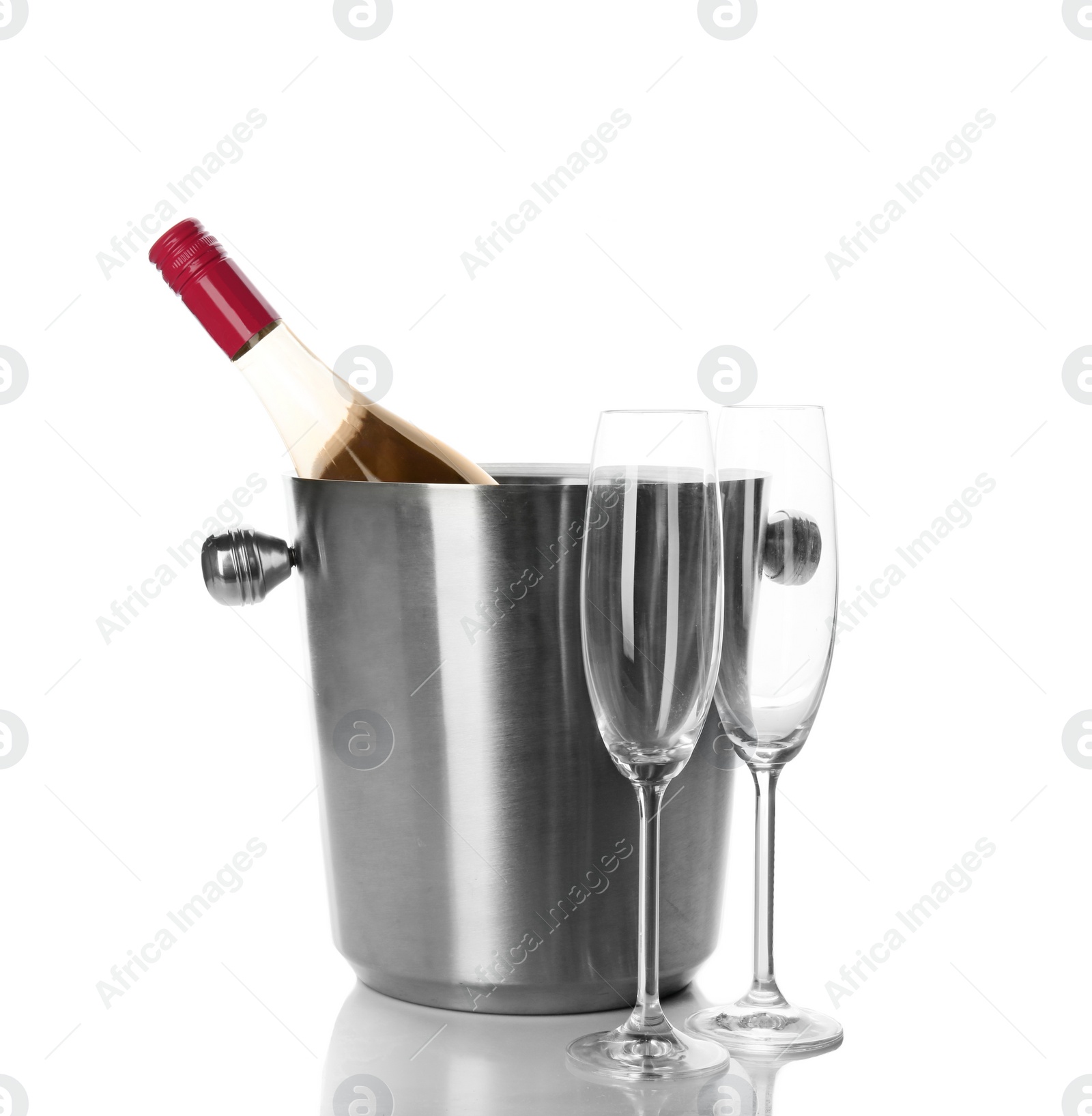 Photo of Bottle of rose champagne in bucket and glasses on white background