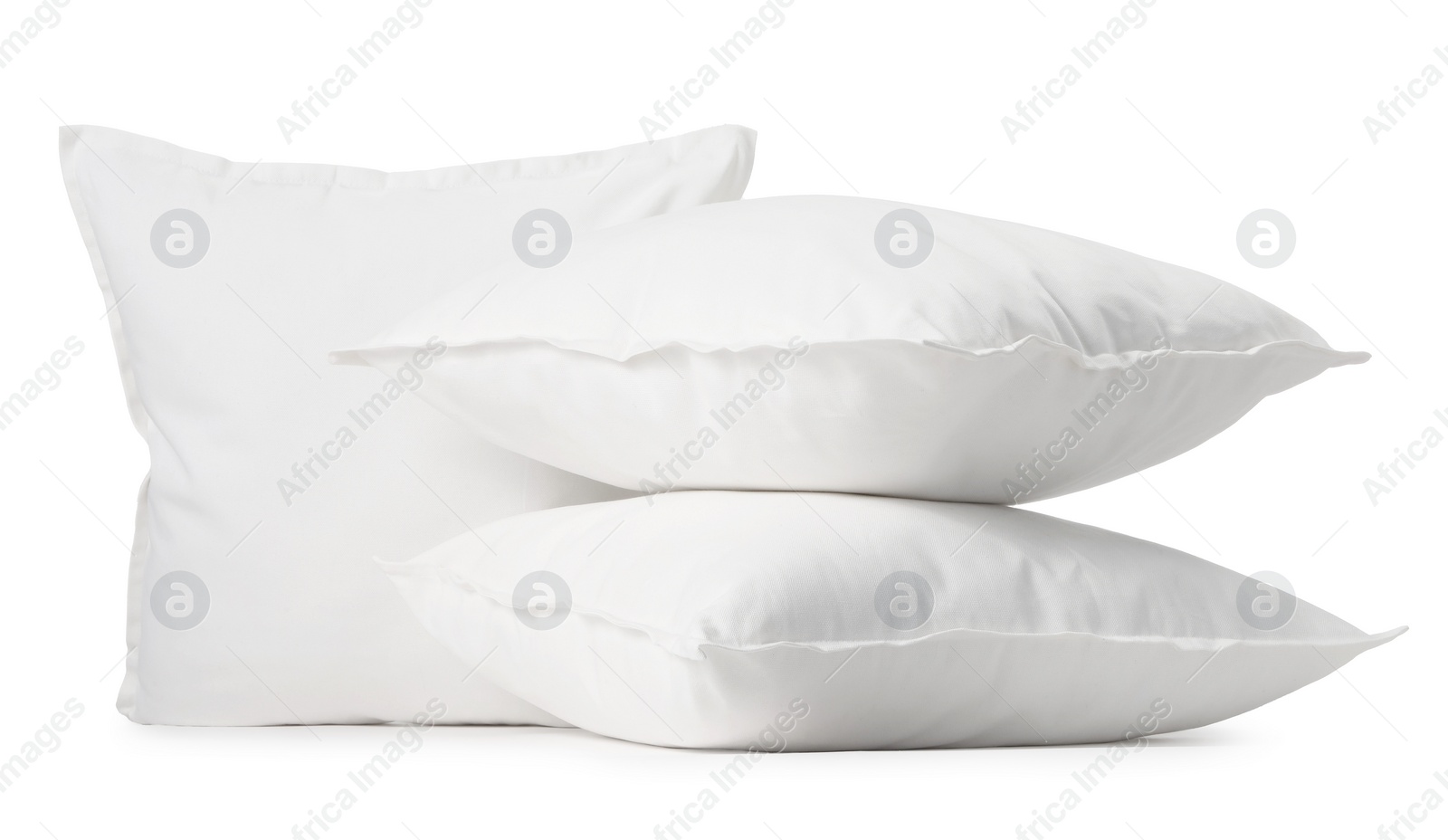 Photo of Three new soft pillows isolated on white