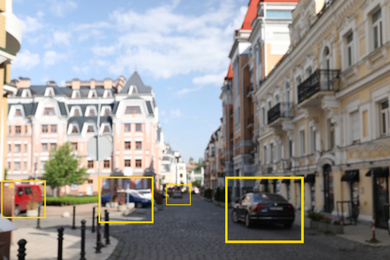 Image of Blurred view of buildings and street with scanner frames on cars in city. Machine learning
