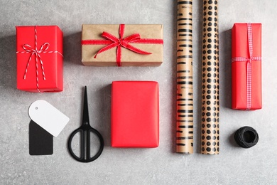 Photo of Flat lay composition with gift boxes on grey background