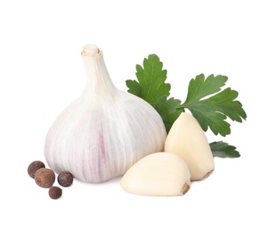Photo of Fresh garlic bulb and cloves with seasonings isolated on white. Organic food