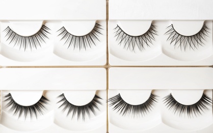 Different types of false eyelashes in packs, top view