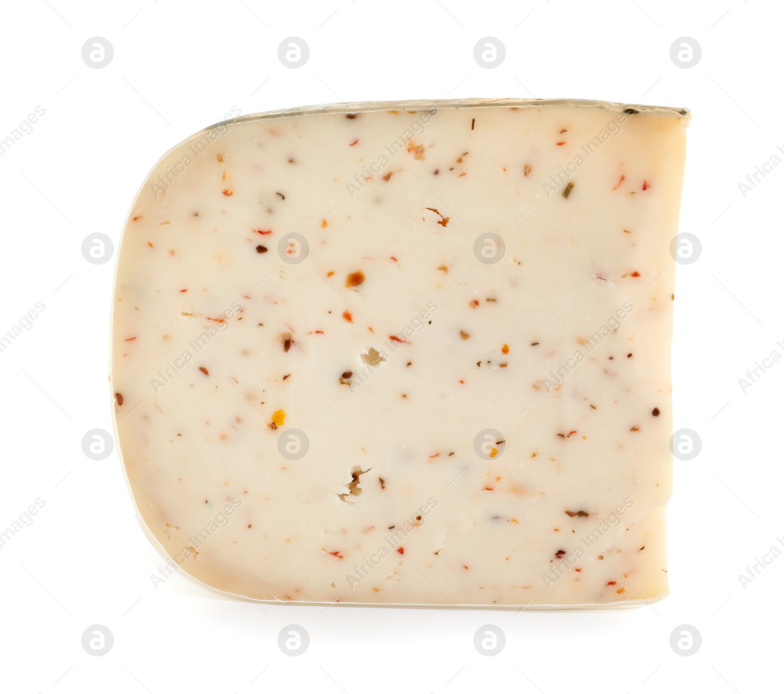 Photo of Piece of tasty cheese with basil and paprika isolated on white