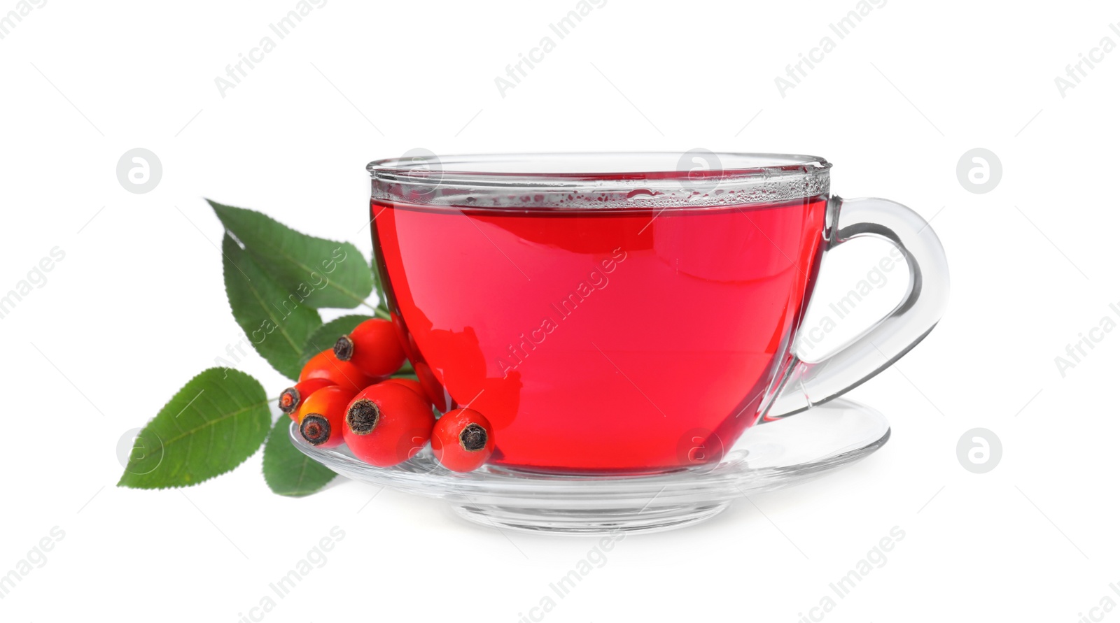 Photo of Aromatic rose hip tea and fresh berries on white background