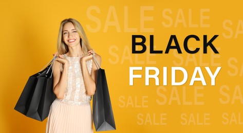 Black Friday Sale. Beautiful young woman with shopping bags on yellow background 