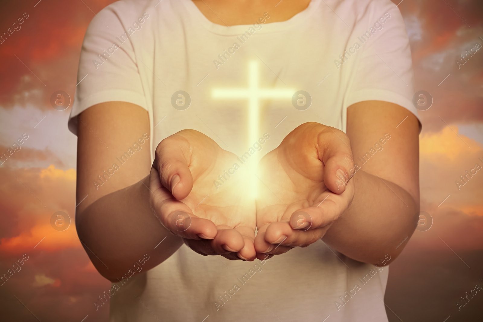 Image of Woman and cross silhouette outdoors, closeup view. Belief in Jesus Christ 