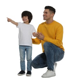 Little boy with his father on white background