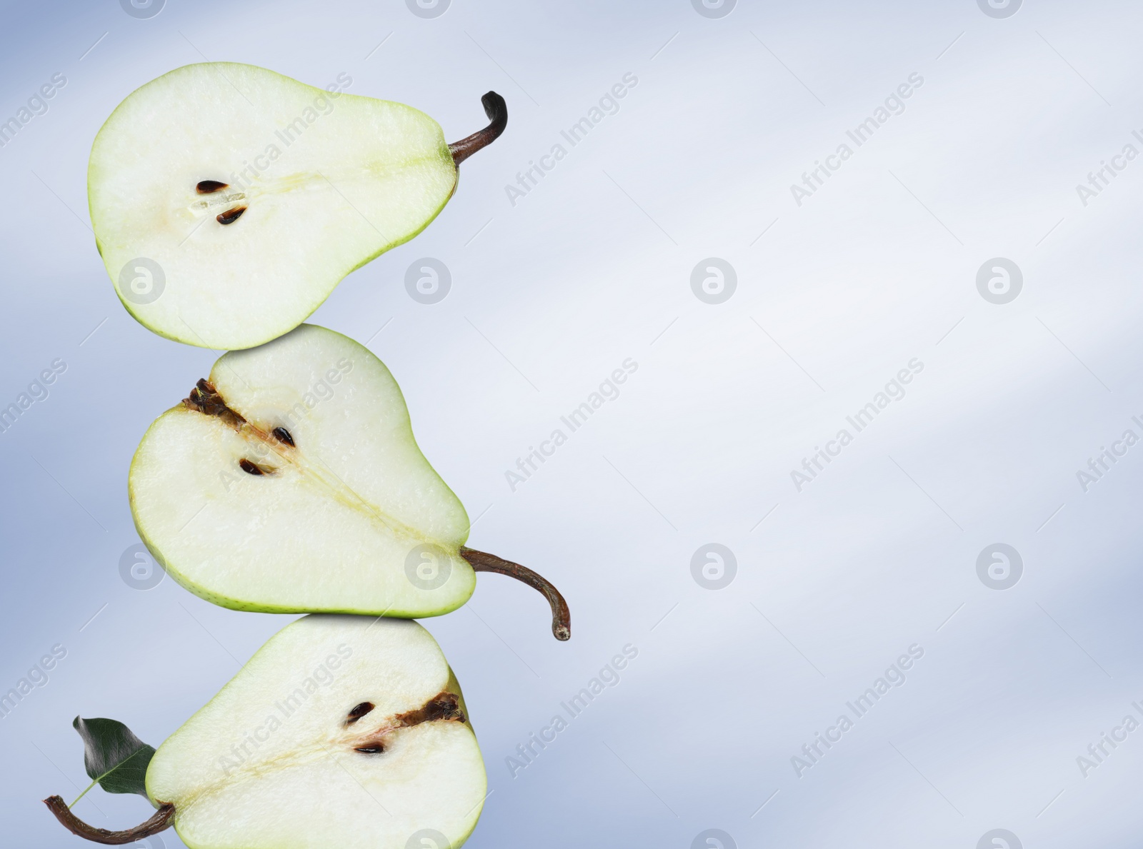 Image of Cut fresh ripe pears on blue gradient background, space for text