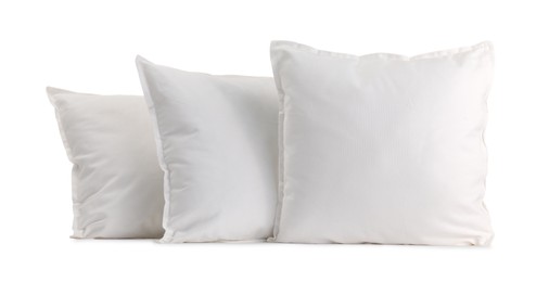 Photo of Many new soft pillows isolated on white