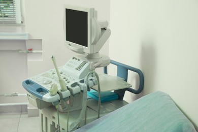 Photo of Ultrasound machine and examination table in hospital