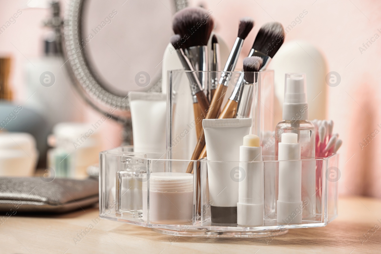 Photo of Set of body care cosmetic products on dressing table