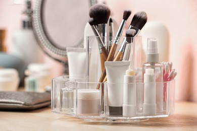 Photo of Set of body care cosmetic products on dressing table