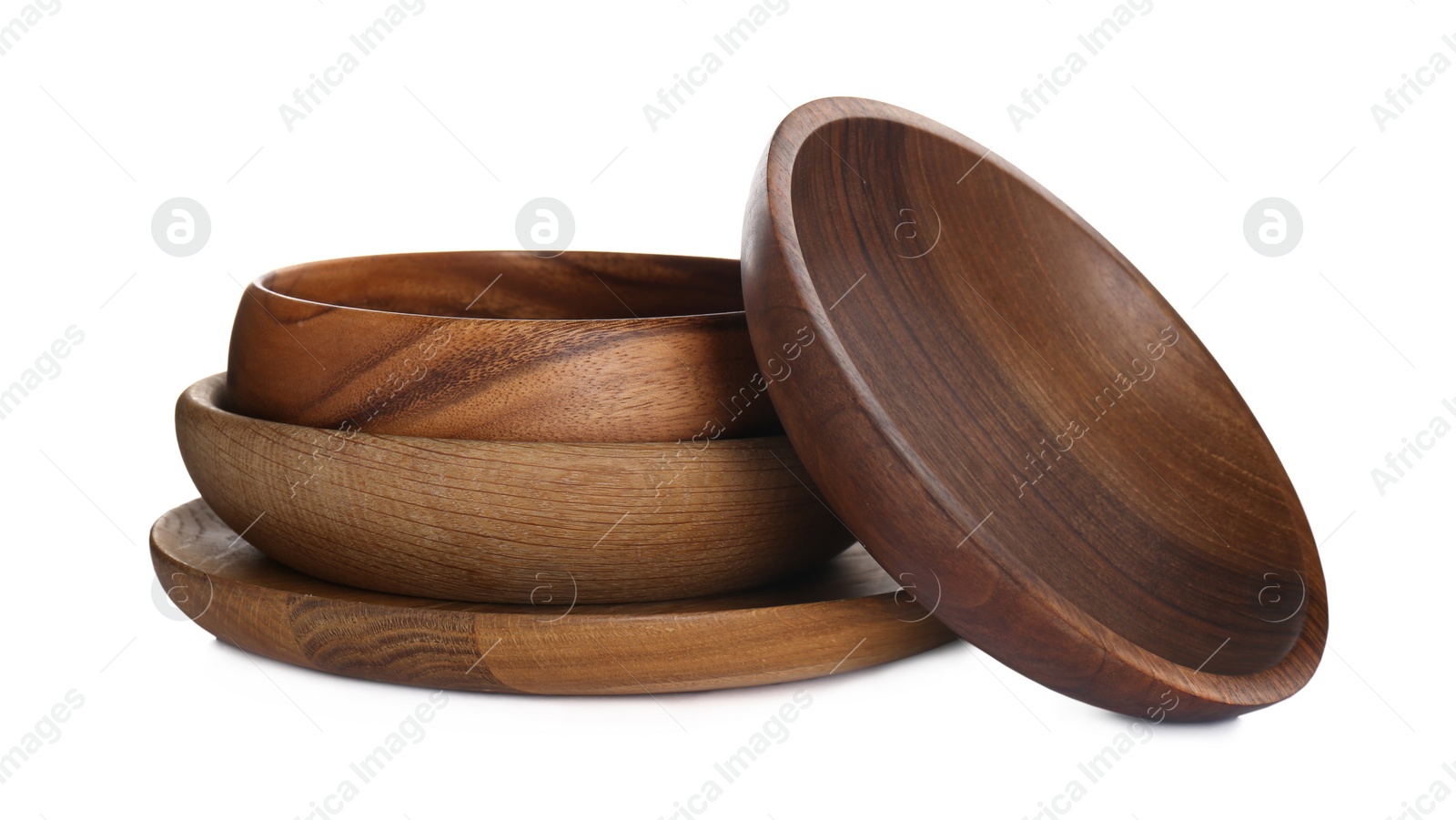 Photo of Wooden plate and bowls on white background