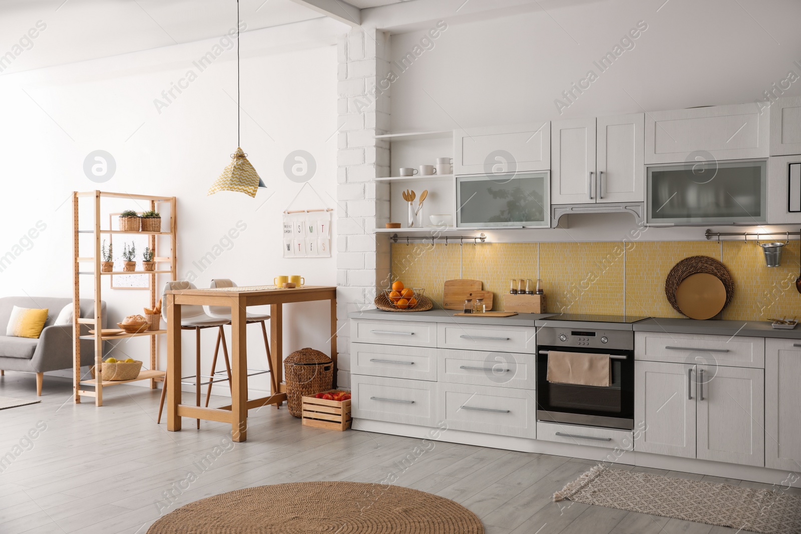 Photo of Modern kitchen interior with stylish wooden table