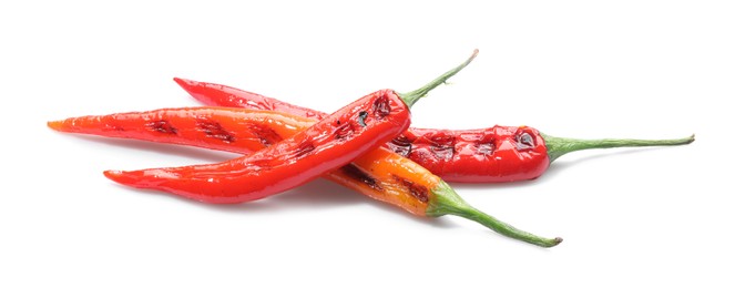 Tasty grilled chili peppers isolated on white