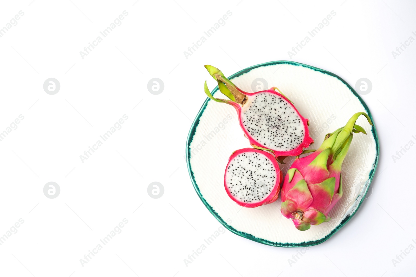 Photo of Delicious cut and whole dragon fruits (pitahaya) on white background, top view