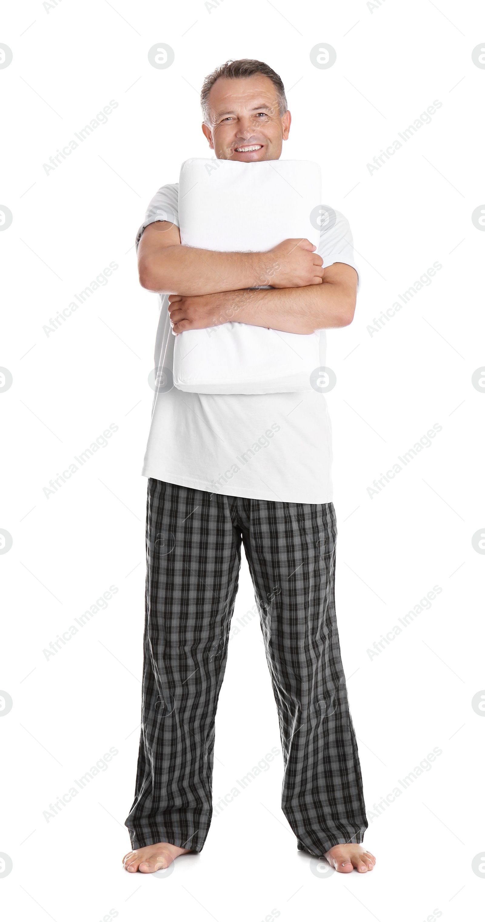 Photo of Man holding soft pillow on white background