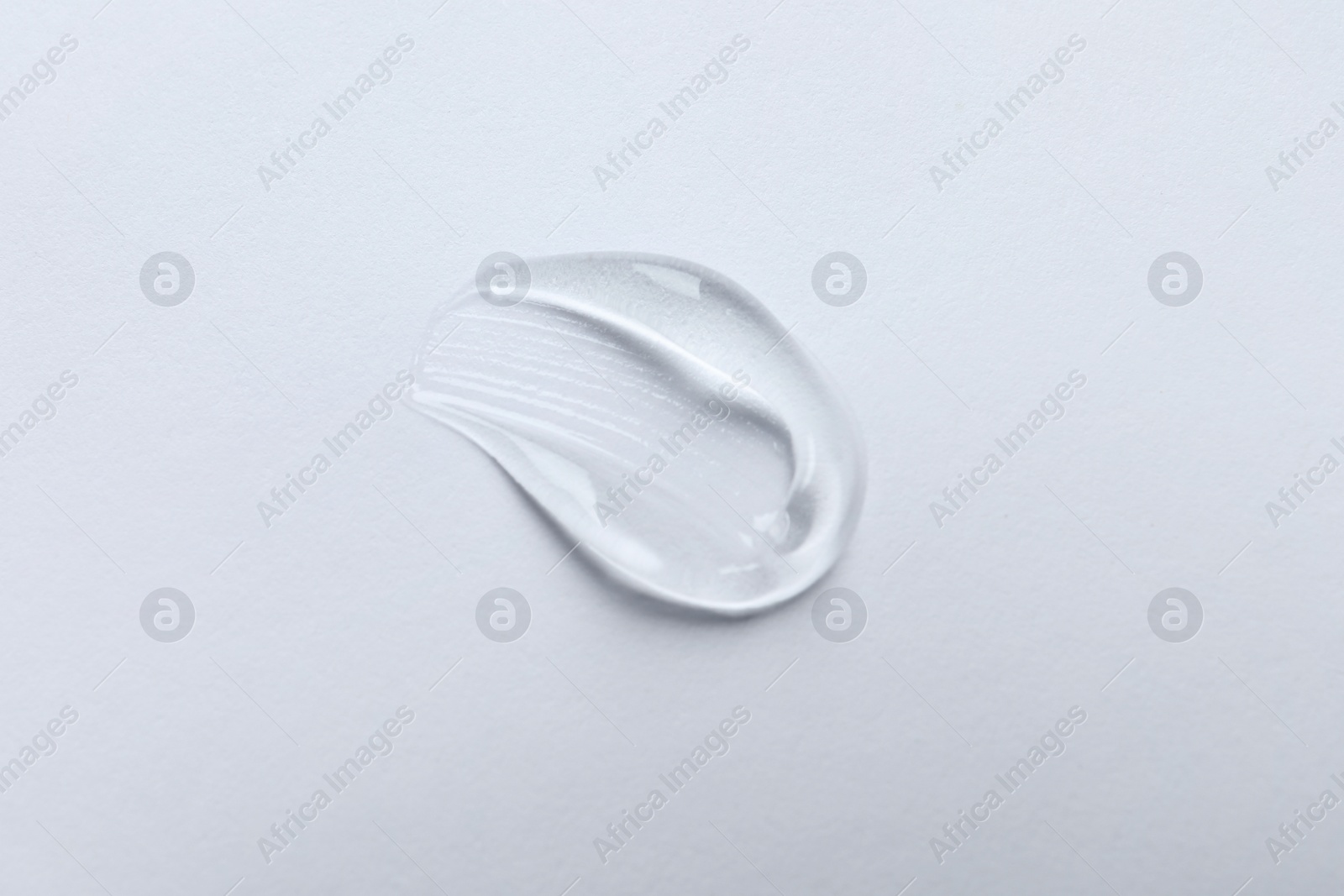 Photo of Swatch of cosmetic gel on white background, top view