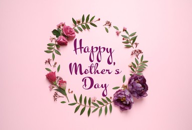 Happy Mother's Day. Frame made of beautiful flowers on pink background, flat lay