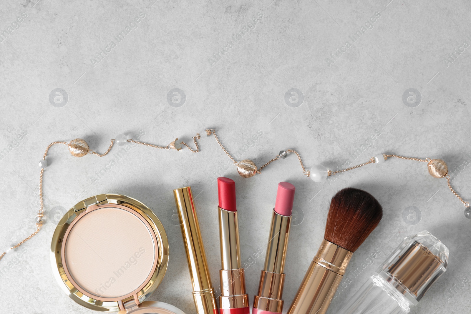 Photo of Flat lay composition with lipsticks on grey background. Space for text