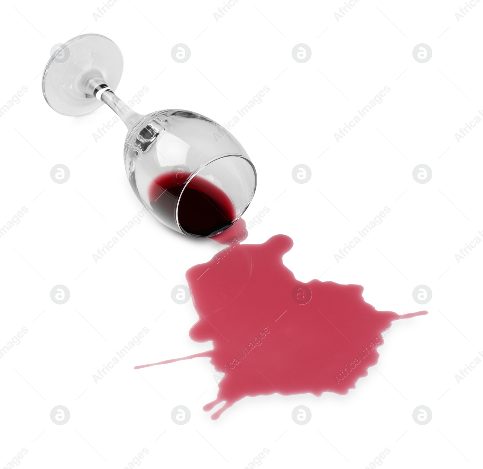 Photo of Overturned glass and spilled wine on white background