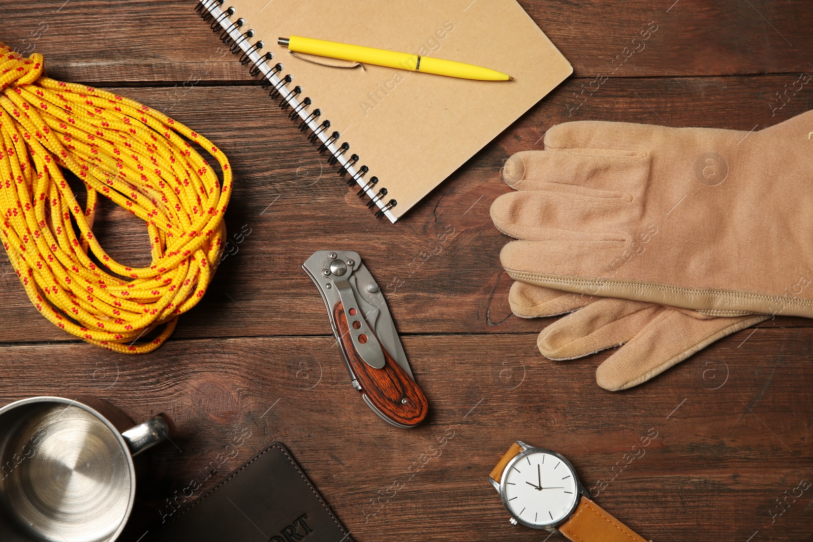 Photo of Flat lay composition with camping equipment on wooden background