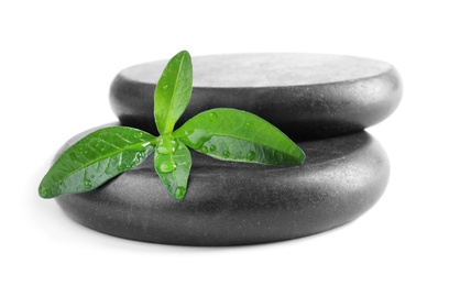 Photo of Spa stones and leaves with water drops on white background