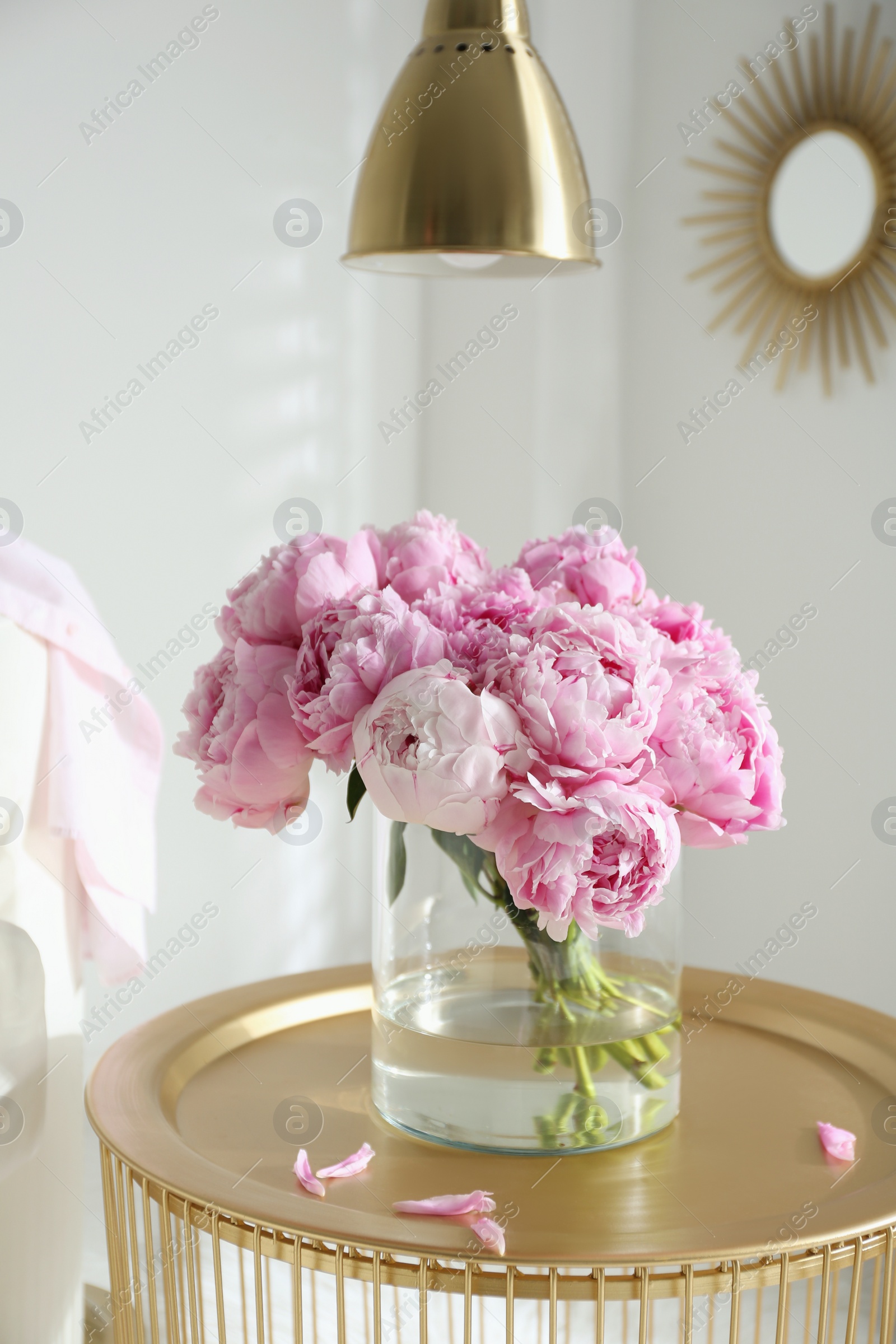 Photo of Bouquet of beautiful peonies on table indoors