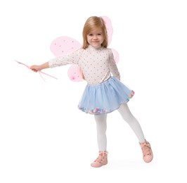 Photo of Cute little girl in fairy costume with pink wings and magic wand on white background